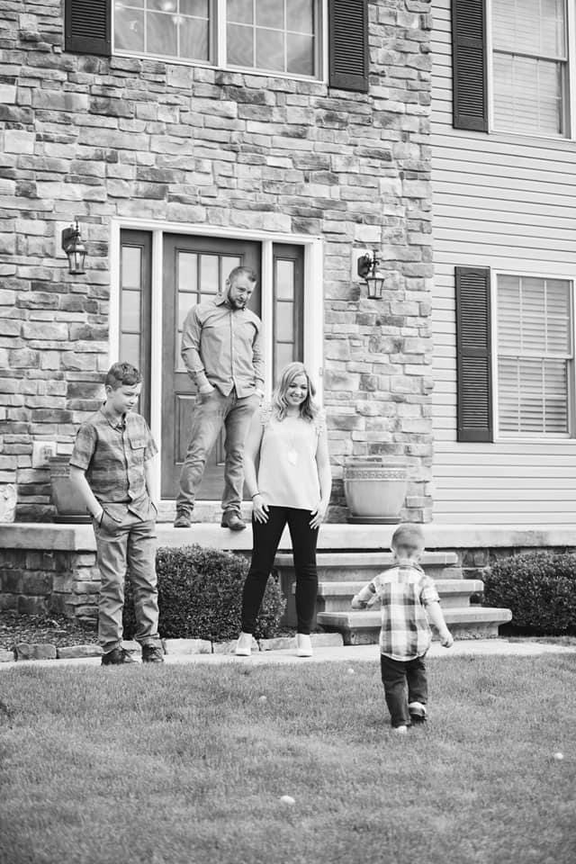 The Strack Family in front of their home